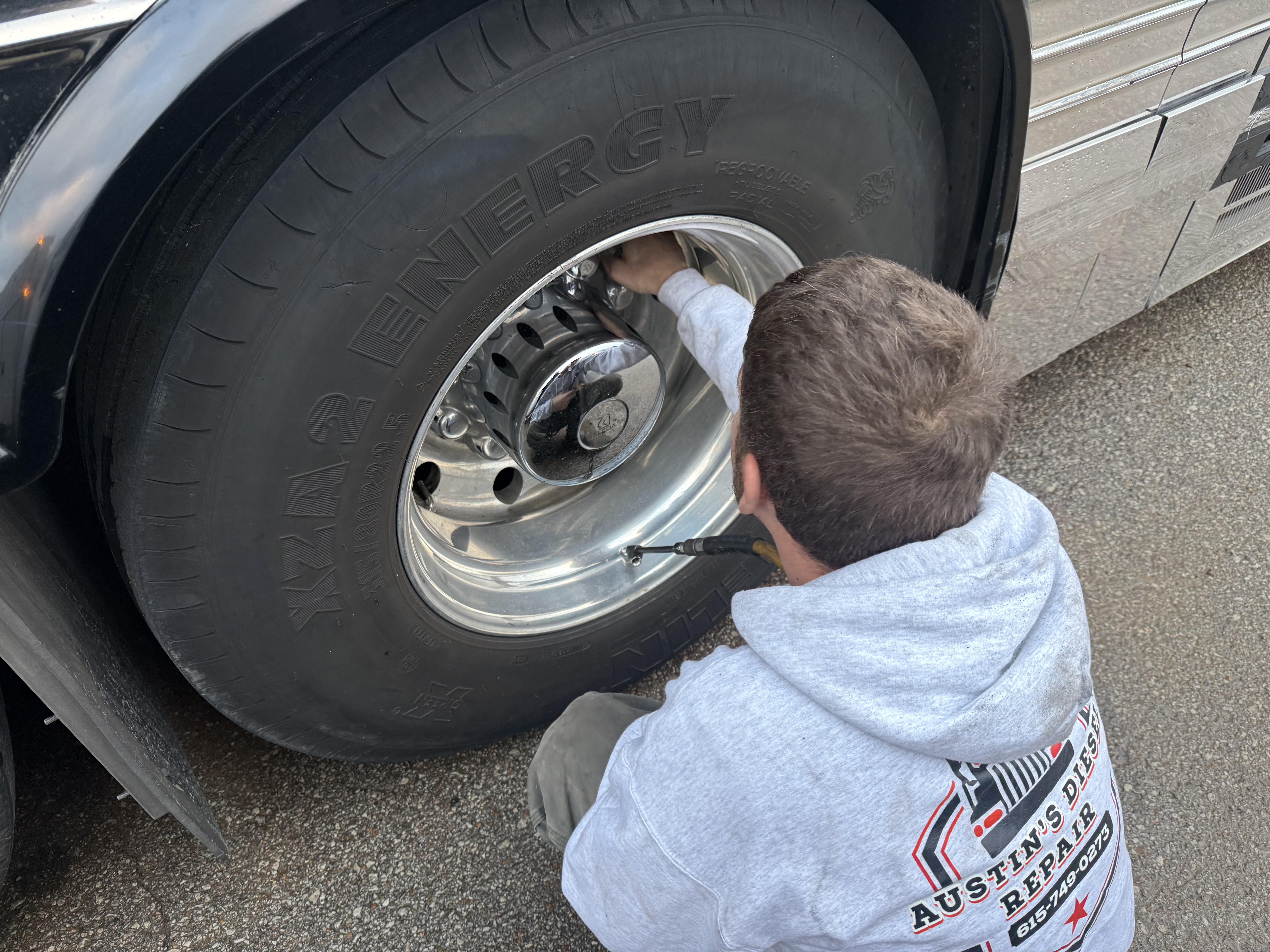 Austin performing tire service on a commercial truck